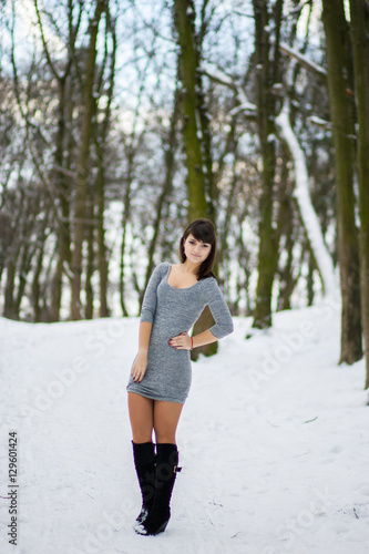 Pretty girl standing in a winter park © Yuliia