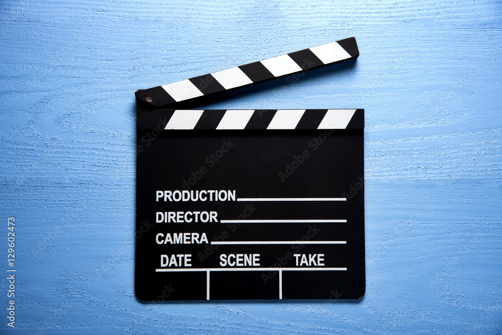 Obraz premium Clapper board,Movie clapper on blue wood backgrond