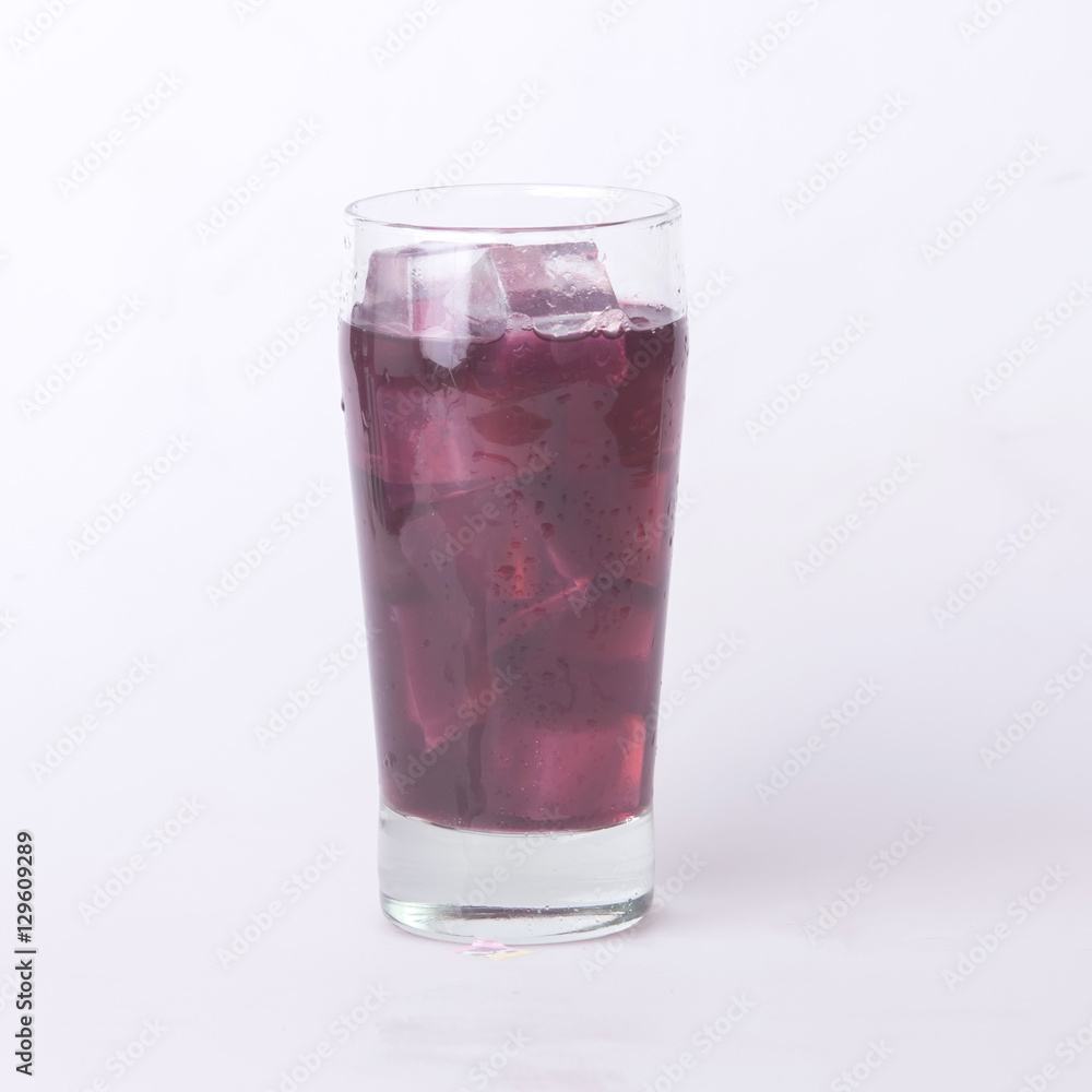 Grape juice in a glass with ice. Grape juice in a glass with ice.