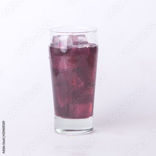 Grape juice in a glass with ice.
