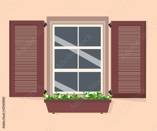 The window with shutters and flowers