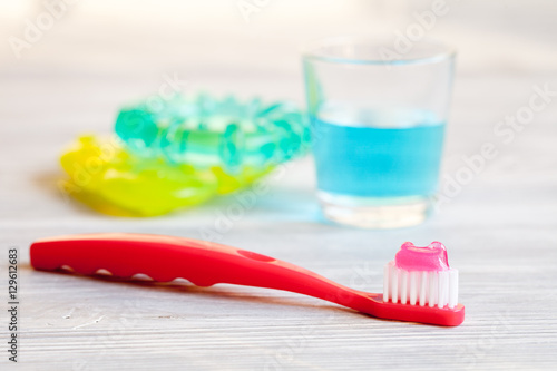 children s toothbrush oral care on wooden background