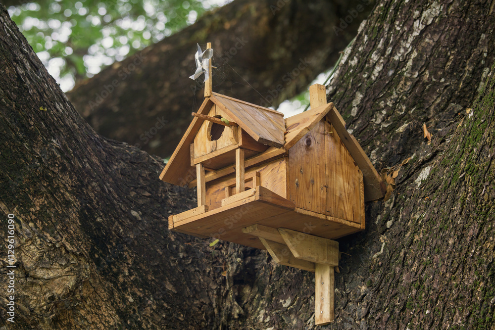 Old Wood bird house on tree in natural background. Old Wood bird house on tree in natural background.