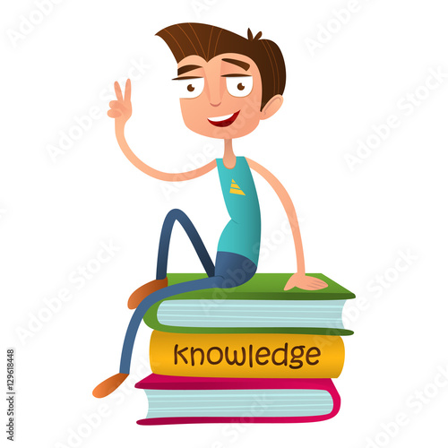 Funny teenage boy sitting on a pile of books and showing two fingers - a sign of Victory.
