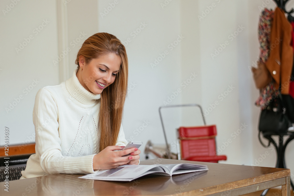 Businesswoman reading magazine in modern office Businesswoman reading magazine in modern office