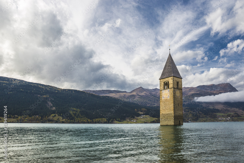 Curon bell tower emerges from the lake Resia - South Tyrol (Italy)