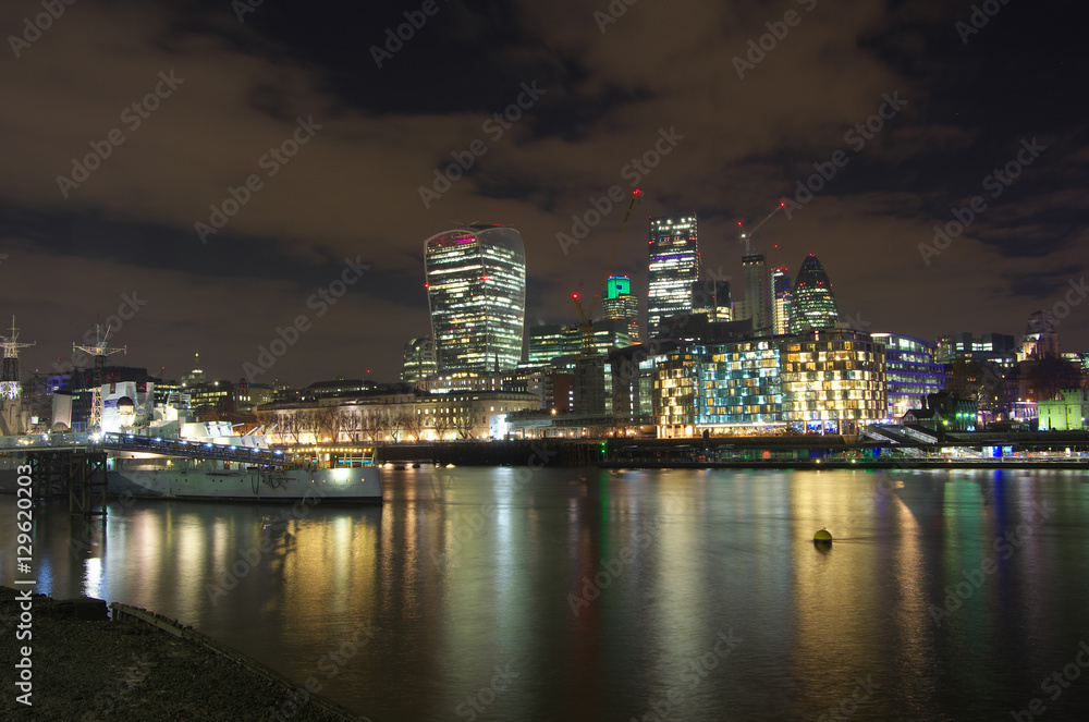 London City skyline by night from the riverside