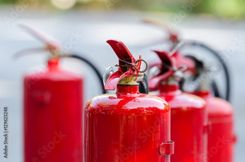 Red tank of fire extinguisher photo