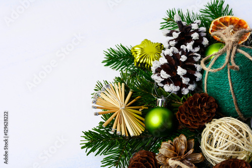 Christmas greeting with straw stars, pine cones and rustic twine