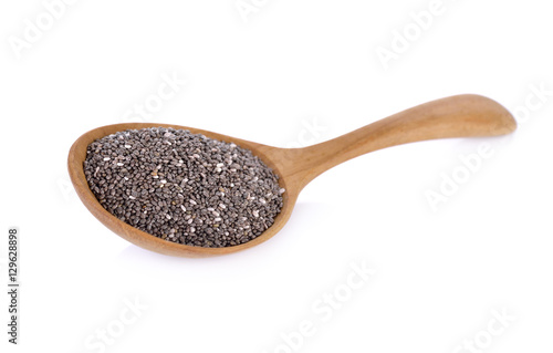 dry chia seeds in wooden spoon on white background