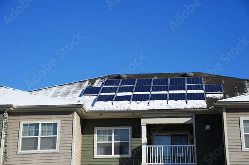 solar panel on the roof after snow in winter