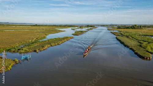 Boat tour around wetland area, ramsar site at Thale noi (part of Songkhla lake) , Phatthalung province, Thailand photo