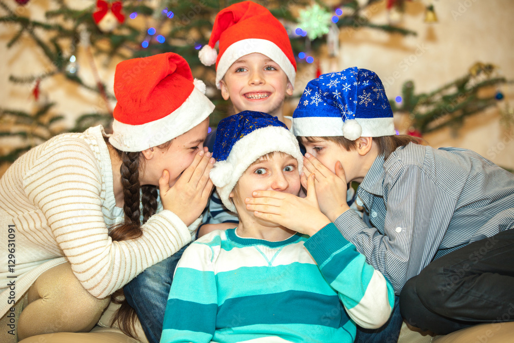Happy group of children near a Christmas tree Happy group of children near a Christmas tree