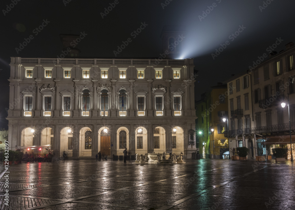 Bergamo - Old city (Citta Alta). One of the beautiful city in Italy. Lombardia. Landscape on the old main square (called Piazza Vecchia), the public library (called Angelo Mai) and Contarini fountain.