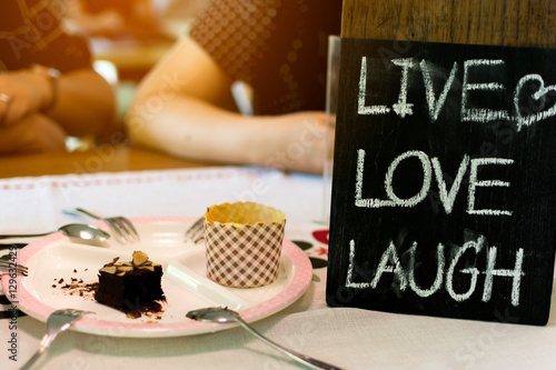 Close up label "LIVE LOVE LAUGH"on coffee shop.