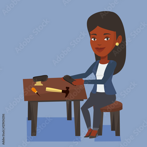 Shoemaker making handmade shoes in workshop.