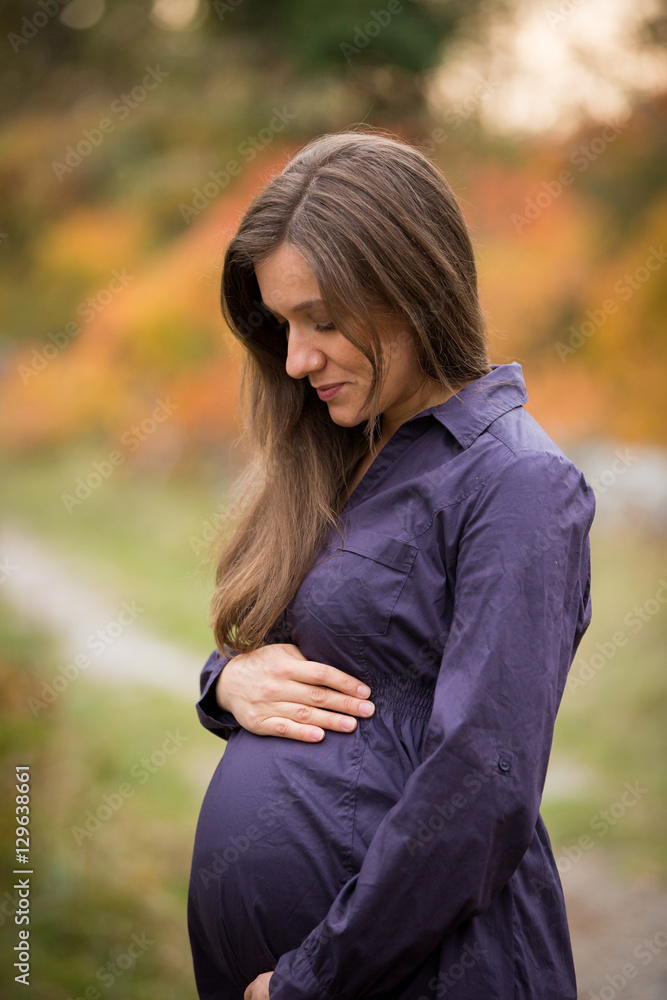 Beautiful pregnant caucasian woman in autumn Beautiful pregnant caucasian woman in autumn