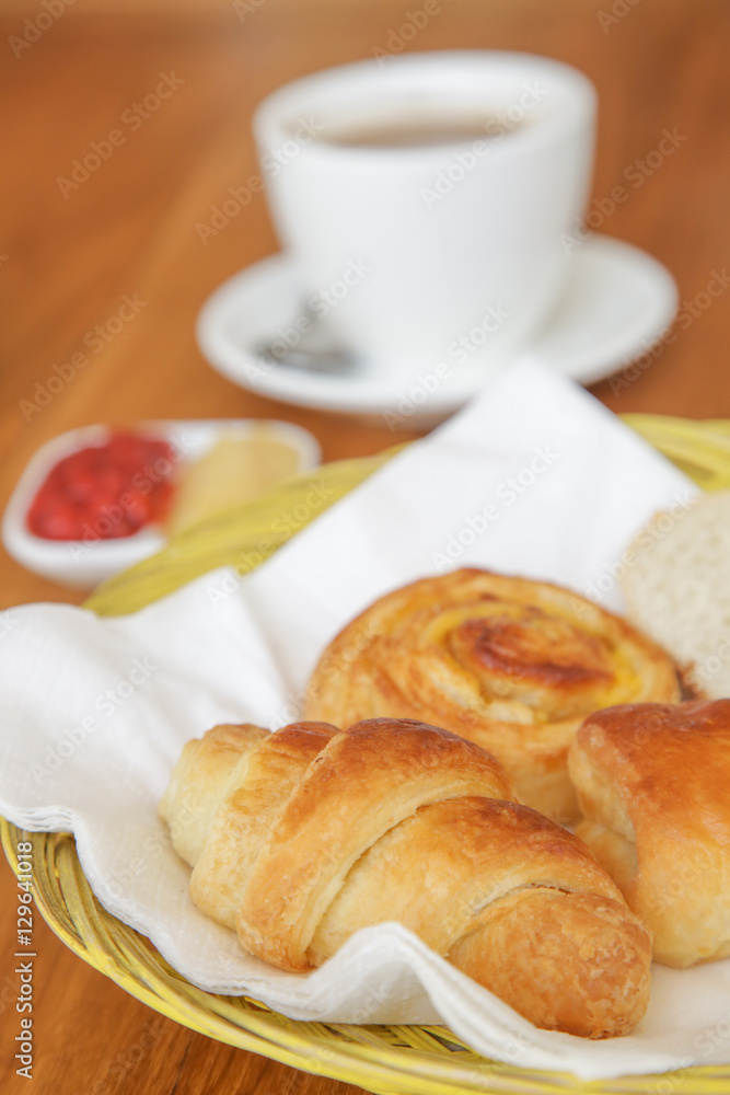 Assorted pastries, coffee and marmalade on the table Assorted pastries, coffee and marmalade on the table