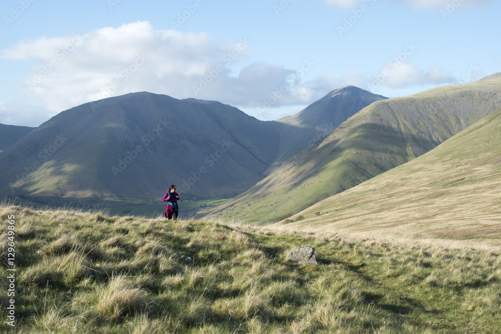 Trekking in the English Lake District in Wasdale with views of Kirk Fell and Great Gable in the distance, Lake District National Park, Cumbria, Euorpe Trekking in the English Lake District in Wasdale with views of Kirk Fell and Great Gable in the distance, Lake District National Park, Cumbria, Euorpe