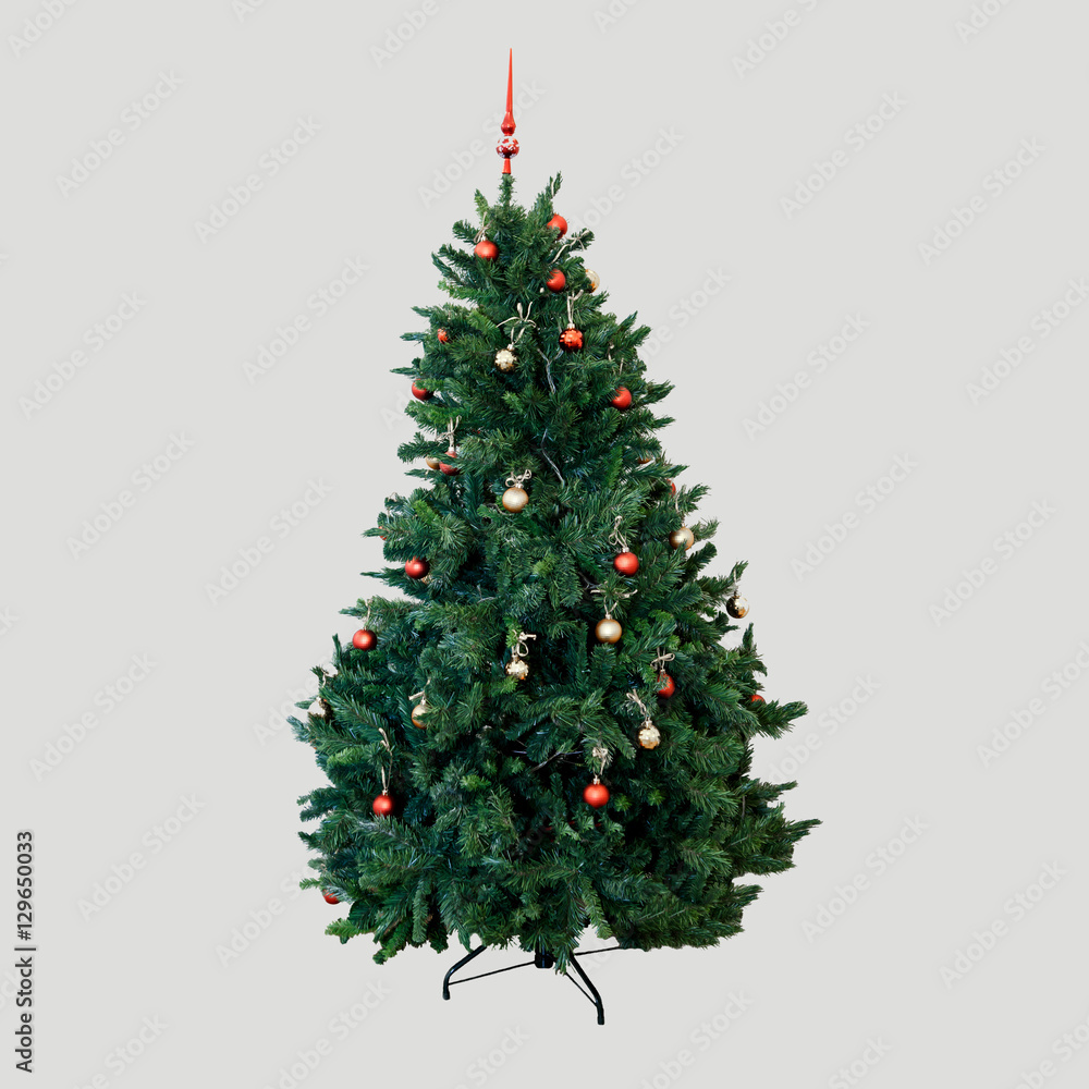 Fototapeta premium New year fir tree decorated with toys and balloons. Green fluffy Christmas beauty natural fir tree. Coniferous symbol of Christmas. Tree isolated on background.