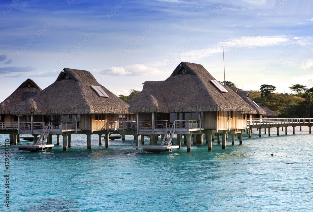 tropical lodges over the sea . Islands at the ocean. tropical lodges over the sea . Islands at the ocean.