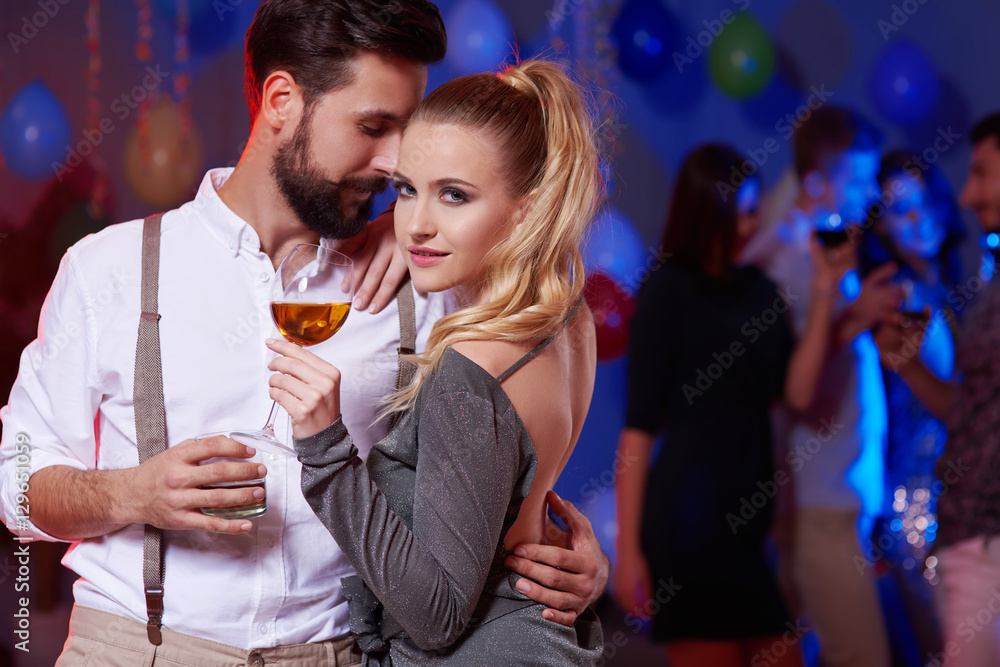 Couple having precious time in party atmosphere
