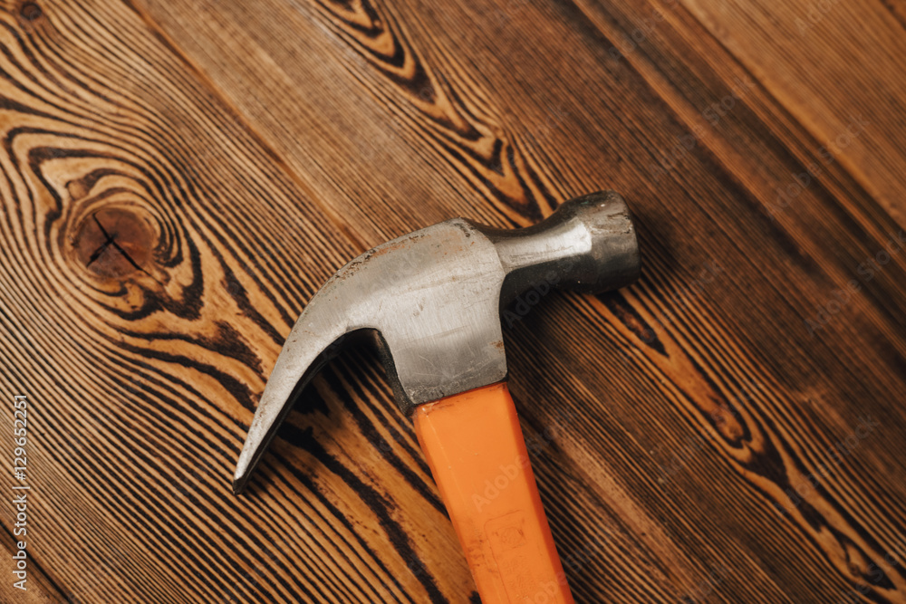 hammer on a wooden background