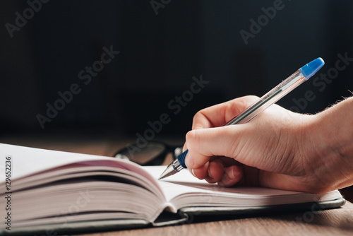 notebook, ballpoint pen, hand