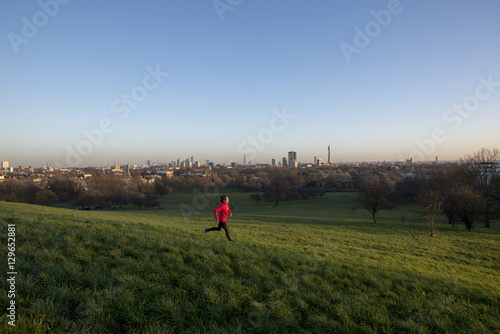 Lizzy Hawker, a world record holding extreme athlete, training on Primrose Hill, London photo
