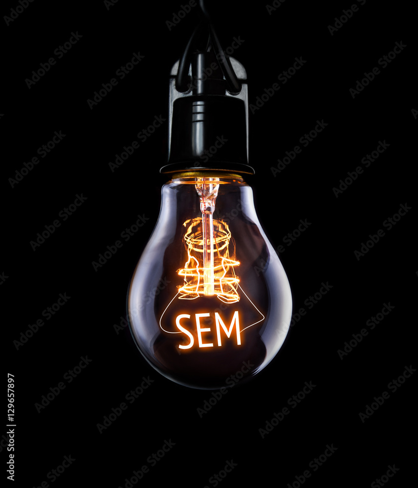 Hanging lightbulb with glowing SEM concept. - obrazy, fototapety, plakaty 