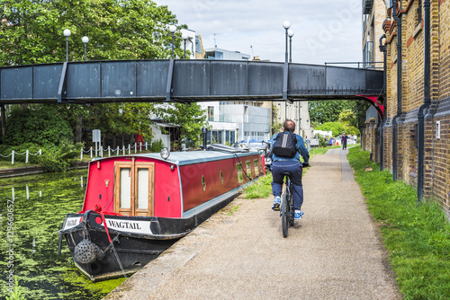 Cycling by the Canal at Ladbroke Grove in the Royal Borough of Kensington and Chelsea, London photo