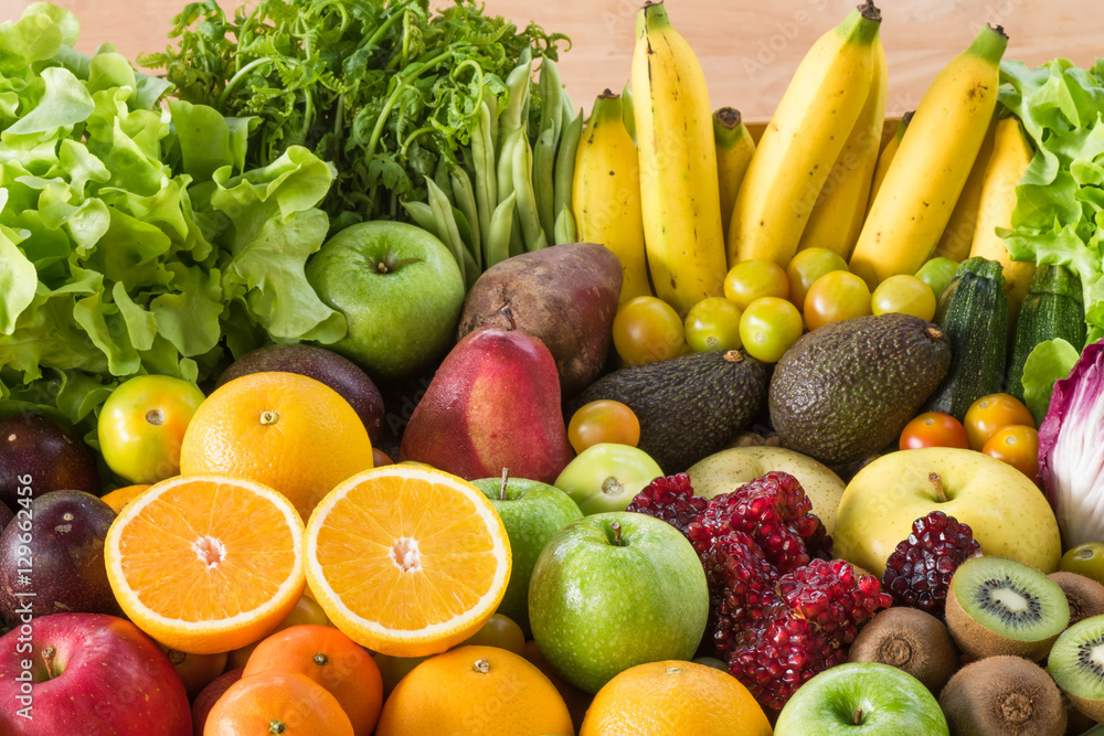 Orange slice with group of Fresh fruits and vegetables for eating healthy Orange slice with group of Fresh fruits and vegetables for eating healthy
