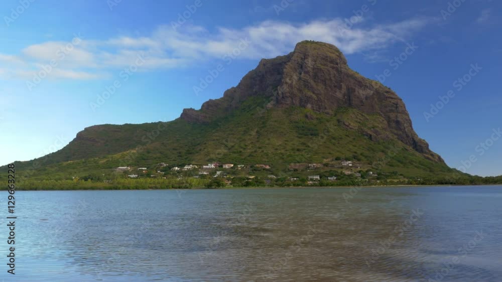 Scene of Le Morne Brabant mountain with water in foreground. Landscapes of Mauritius