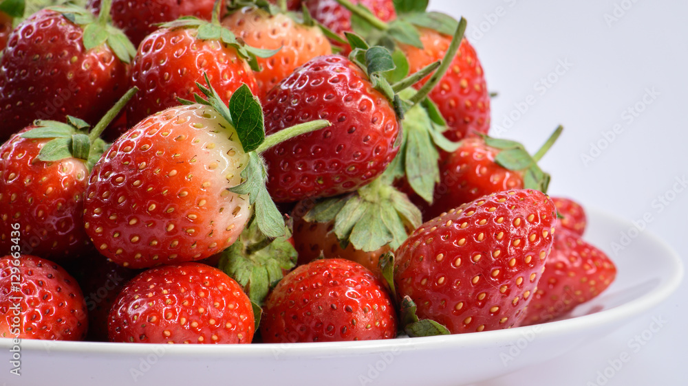 Beautiful close up red fresh organic strawberry on white background Beautiful close up red fresh organic strawberry on white background