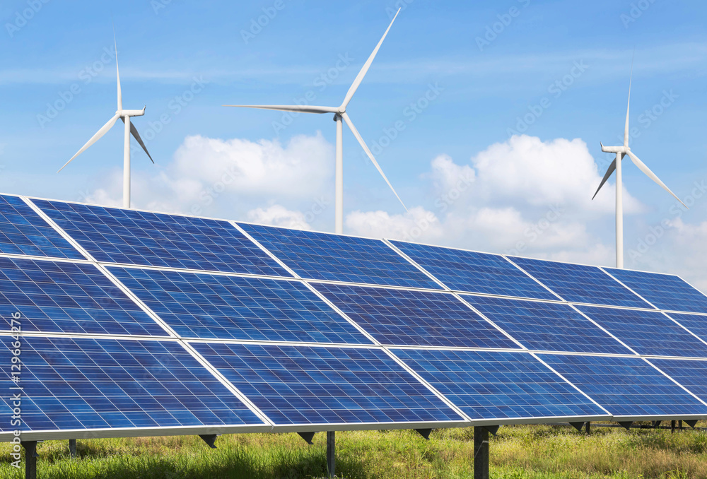 solar panels and wind turbines generating electricity in power station ...