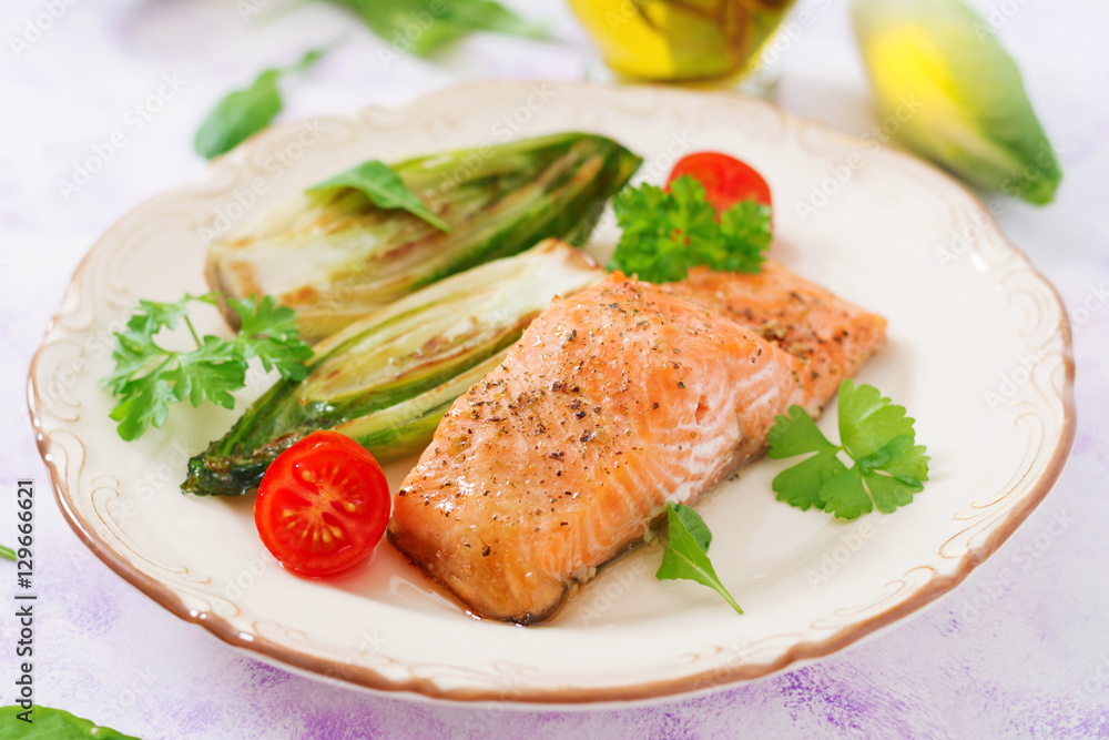 Baked salmon with Italian herbs and garnished with chicory Baked salmon with Italian herbs and garnished with chicory