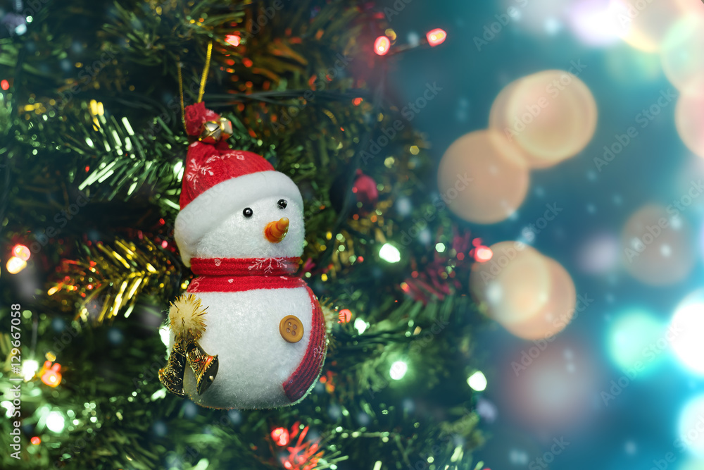 close up soft focus snowman on blurry christmas tree backgroud close up soft focus snowman on blurry christmas tree backgroud