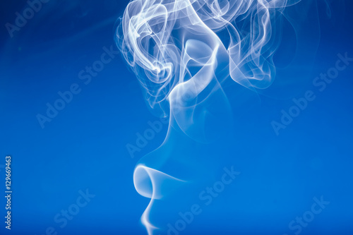 White smoke shape on a blue backgrounds