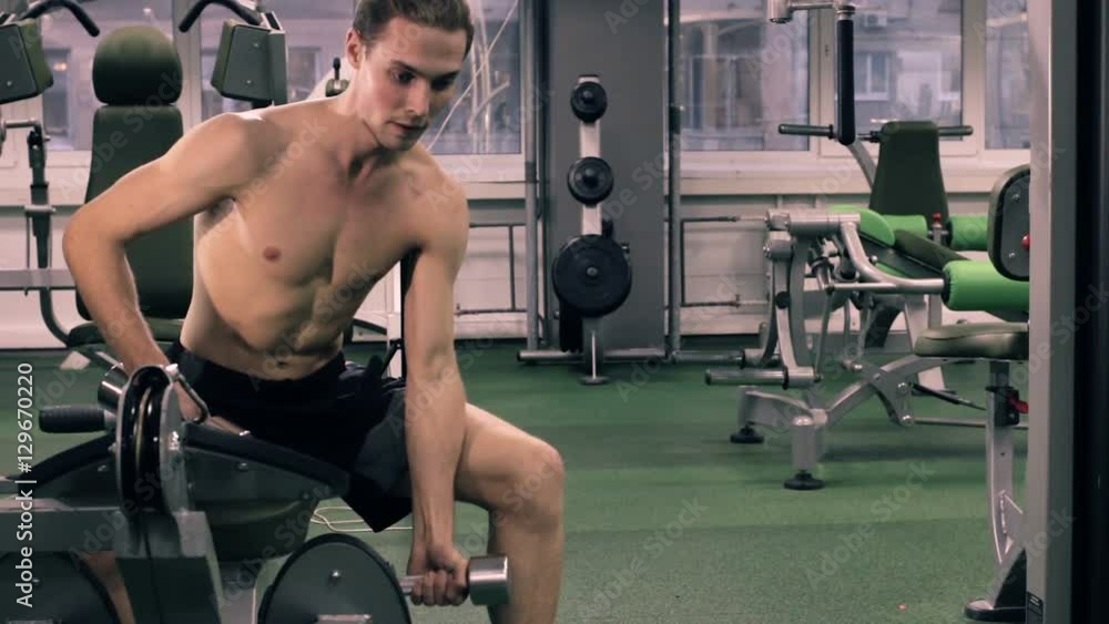 Muscular Man Working Out With Dumbbells Muscular Man Working Out With Dumbbells