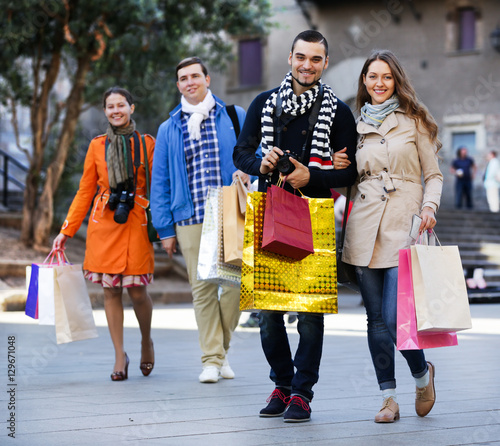 Group of adults with shopping bags