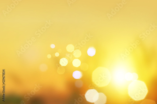 Blurred background : sunset landscape with bokeh sun light abstract background. blur concept. Retro color style. mountain background grass, wallpaper design