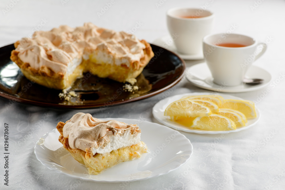 piece of lemon cake with a cups of tea piece of lemon cake with a cups of tea