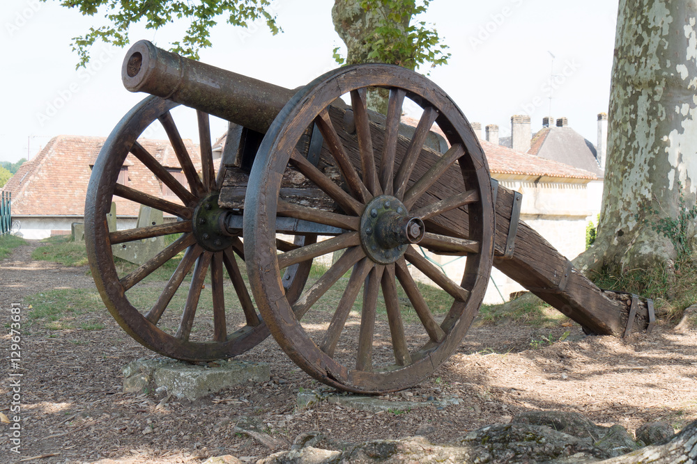 antique cannon with wooden wheels