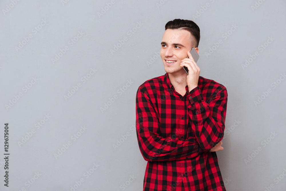 Man in shirt talking on phone Man in shirt talking on phone