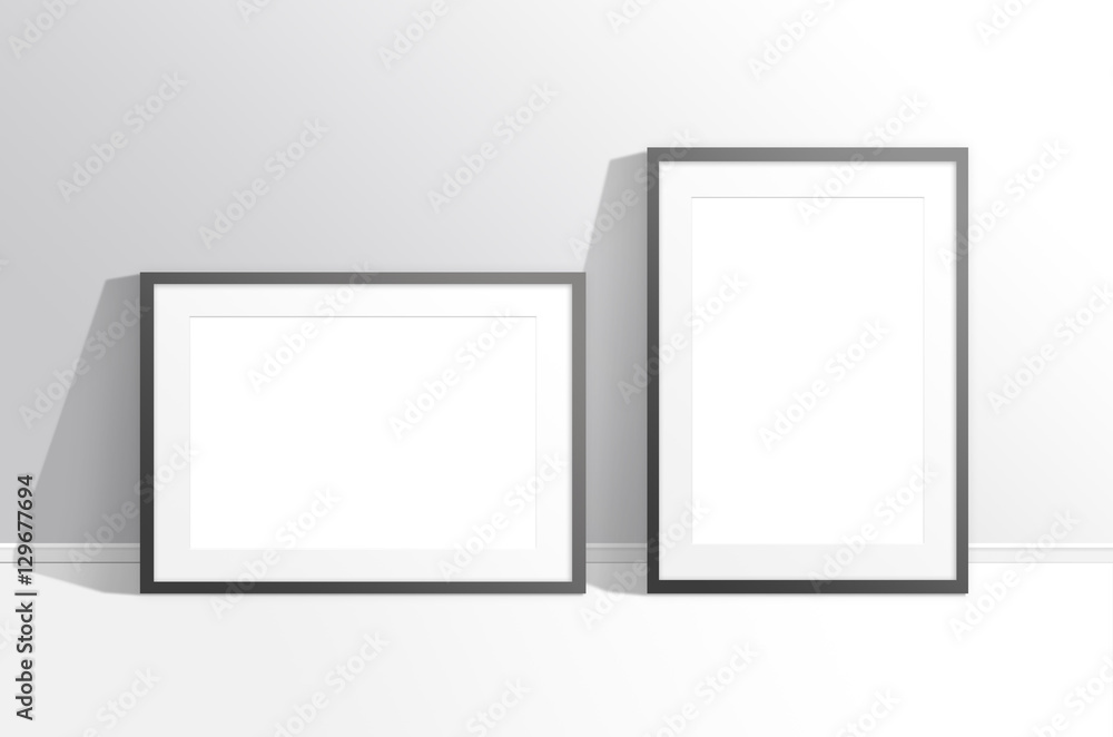 Two blank frames against the wall, mock up. Interior decor Two blank frames against the wall, mock up. Interior decor