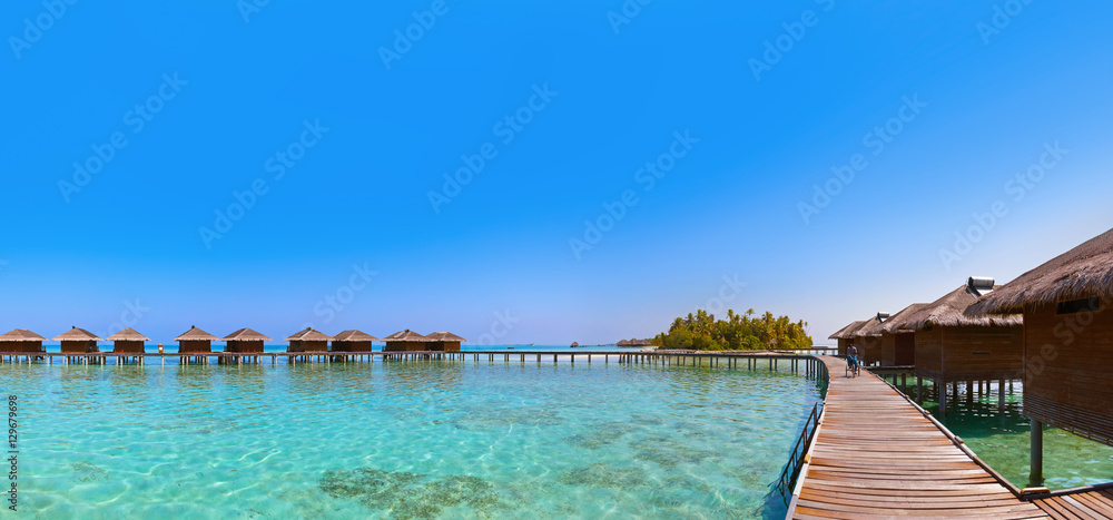 Bungalows on tropical Maldives island