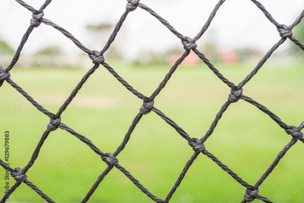 Fototapeta premium Soccer goal net on green background