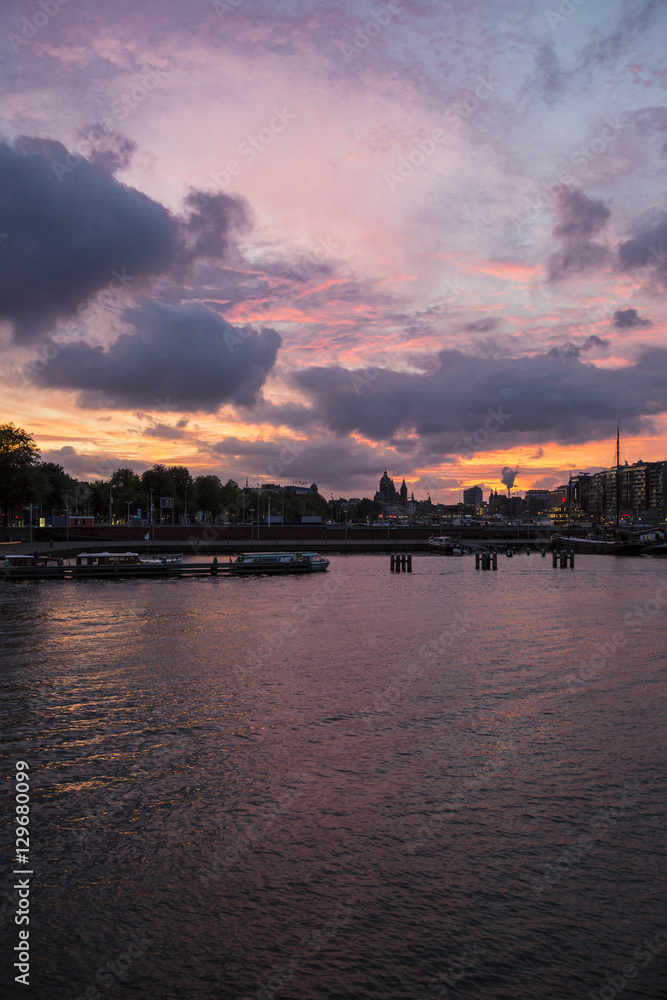 Romantic purple sunset over the Amsterdam harbour, the Netherlands