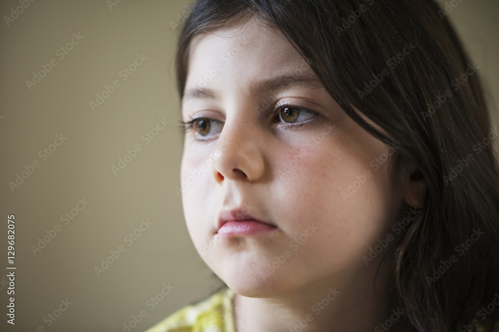 Sad young girl looking away Sad young girl looking away