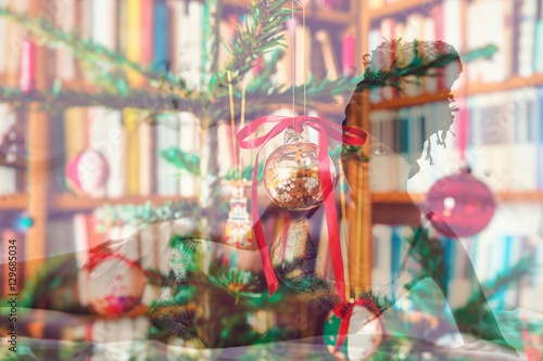 Double exposure of african beautiful woman lying and Christmas decorations